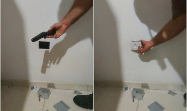 Pistola e carregadores de munições são encontrados dentro de falsa tomada em apartamento em MG